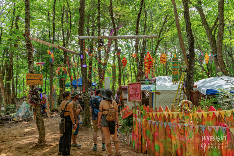 A painted art booth in the forest at Future Forest