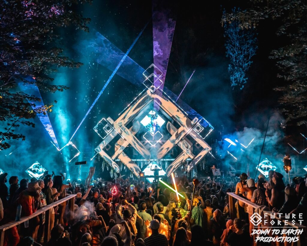 The Prism Stage at Future Forest, a glowing geometric structure lit over the crowd at night